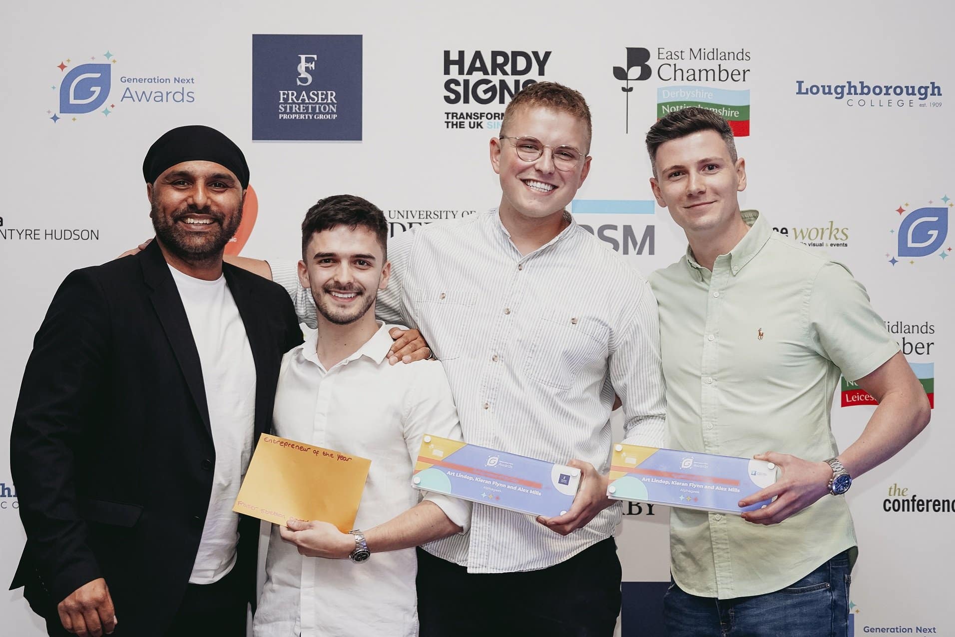 Narinder Nijjar, from sponsors Fraser Stretton, presents the Generation Next Entrepreneur of the Year award to Alex Mills, Art Lindop and Kieran Flynn, from Derby digital marketing agency Alphageek.