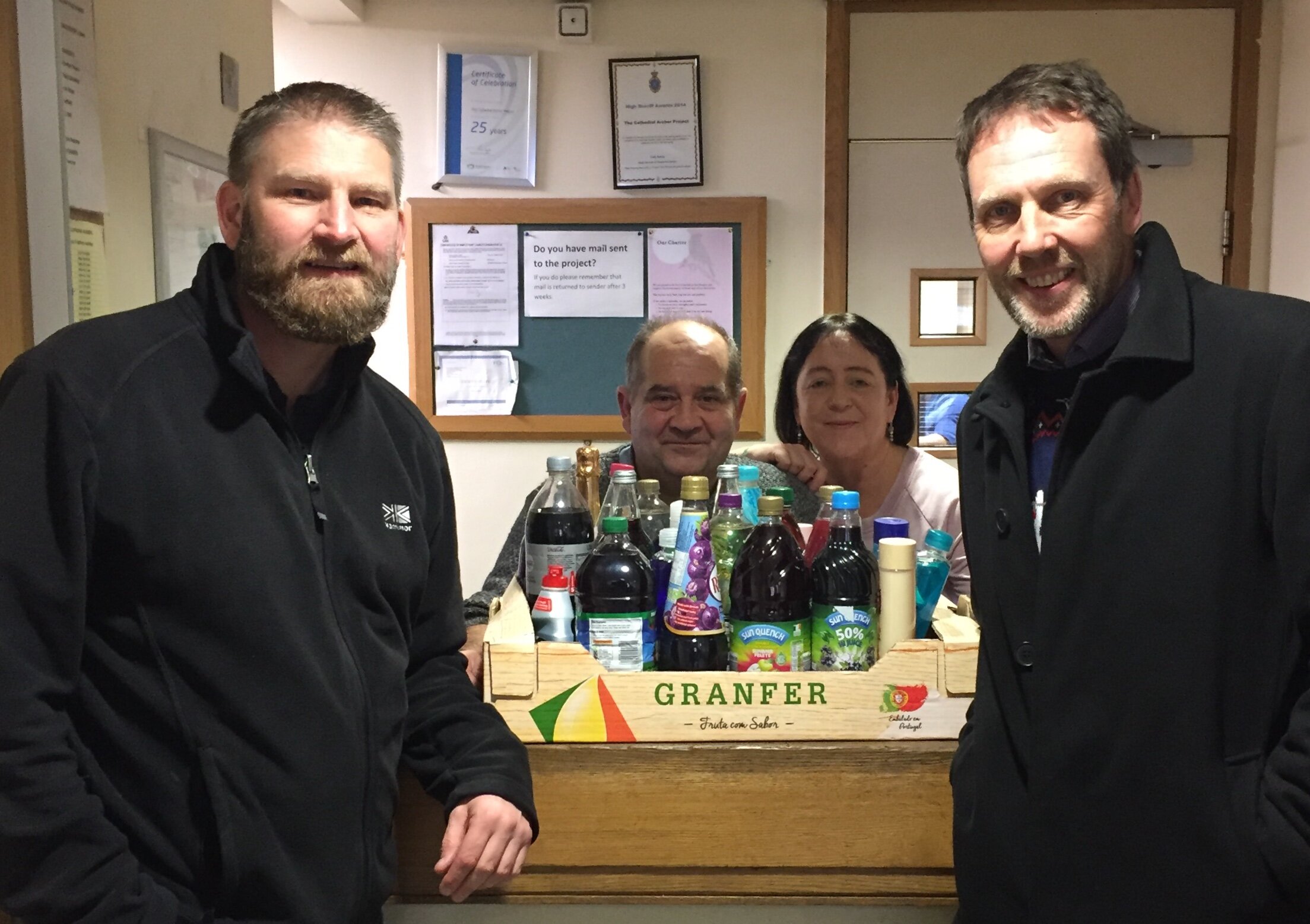 Andy Parfrement, left, manager of the Cathedral Archer Project, with volunteers from the project and David Simpson, principal of Listerdale Junior Academy, who donated toiletries and groceries collected by the school’s teaching staff.