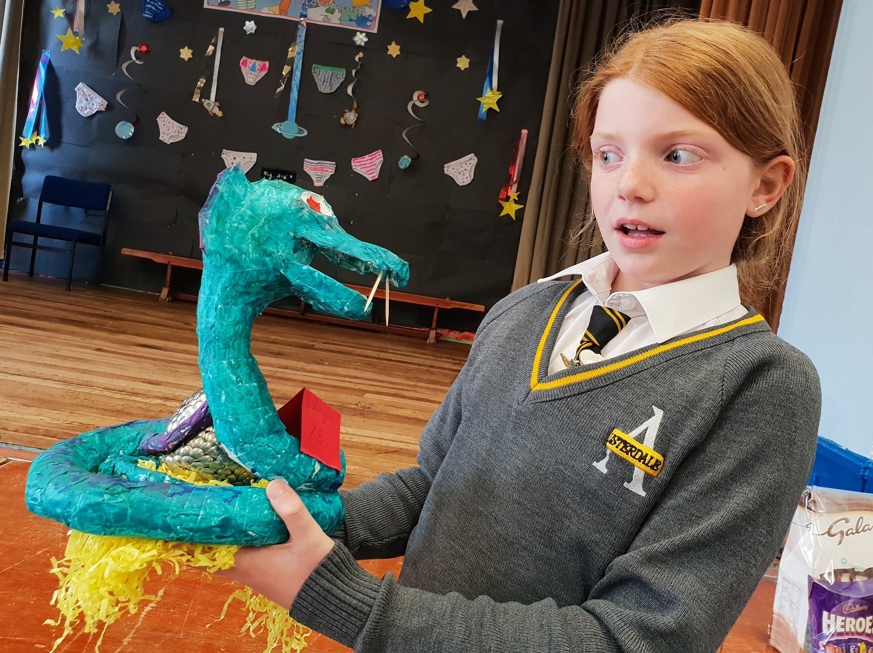 Bethany Winterbottom, 10, comes eye-to-eye with her creation - a scary snake guarding an Easter egg. Penguin PR: public relations, media and communications