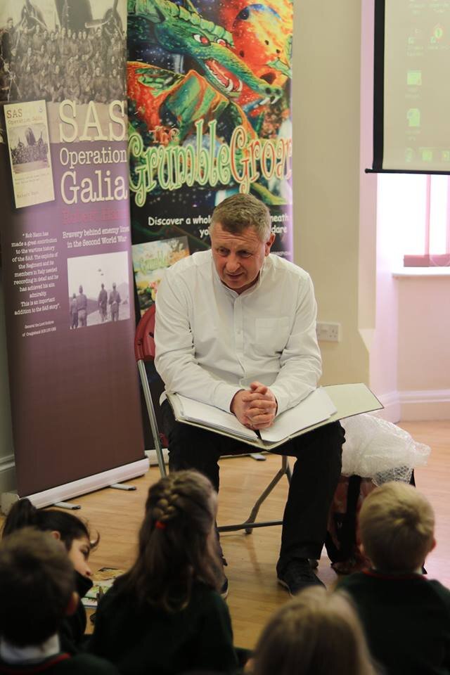 Children’s author Rob Hann, pictured during a visit to Nottingham’s Hollygirt School, has won £250 to help launch reading, rhyme and drawing/illustration sessions at care homes, where groups of schoolchildren will take part in the activities alongsi…