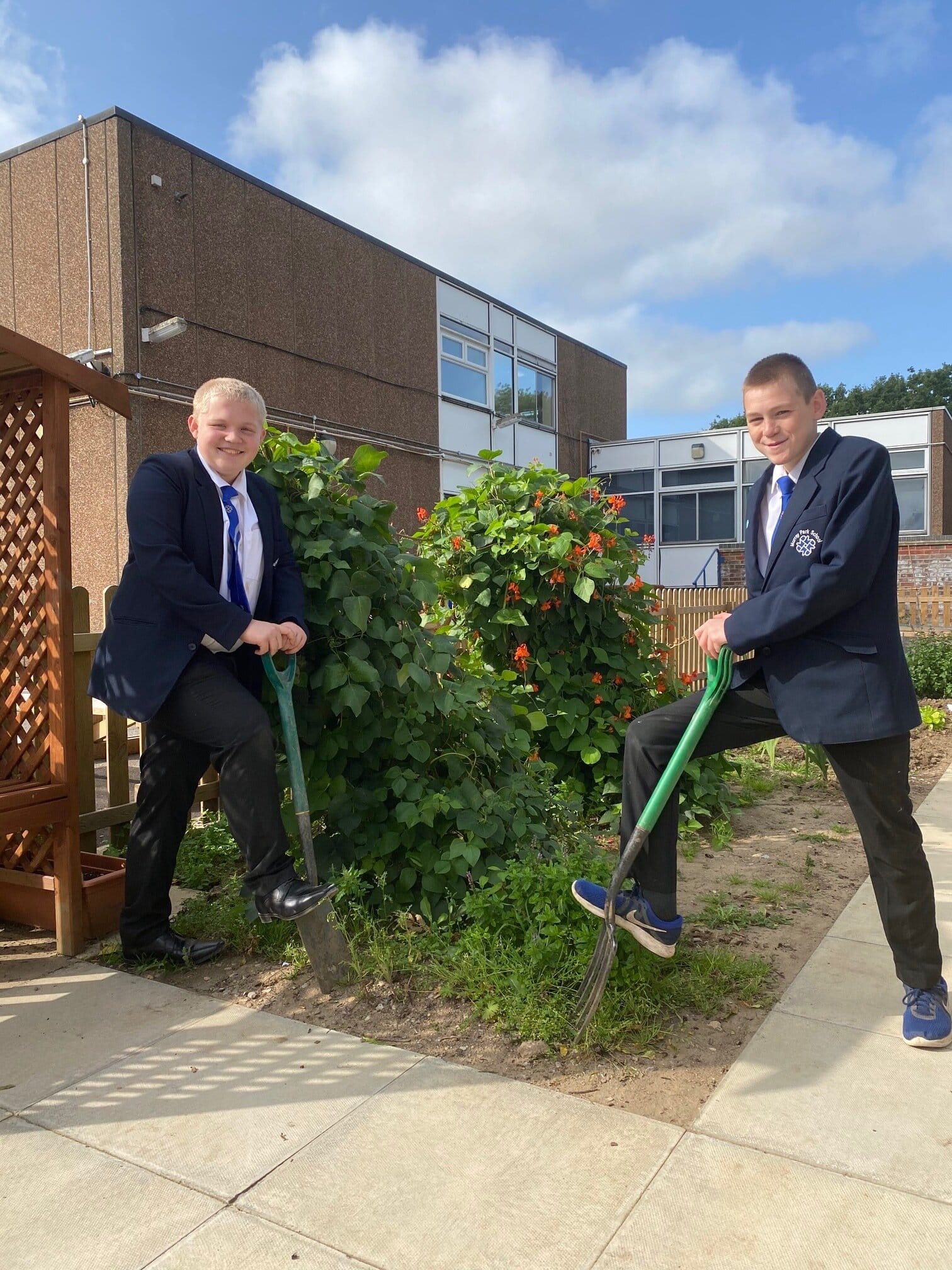 Pupils Dan (left) and Josh (right) showing their love for gardening.