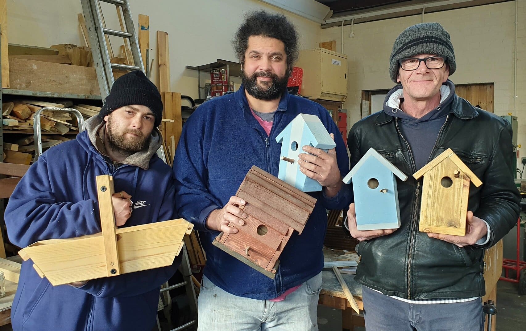 From left, Growing Lives community project participant Danny, with workshop manager Vitor Azevedo and participant Wayne. The scheme, based in Cotmanhay, Derbyshire, has been extended for two more years, with mentors set to be recruited to help new starters settle in.