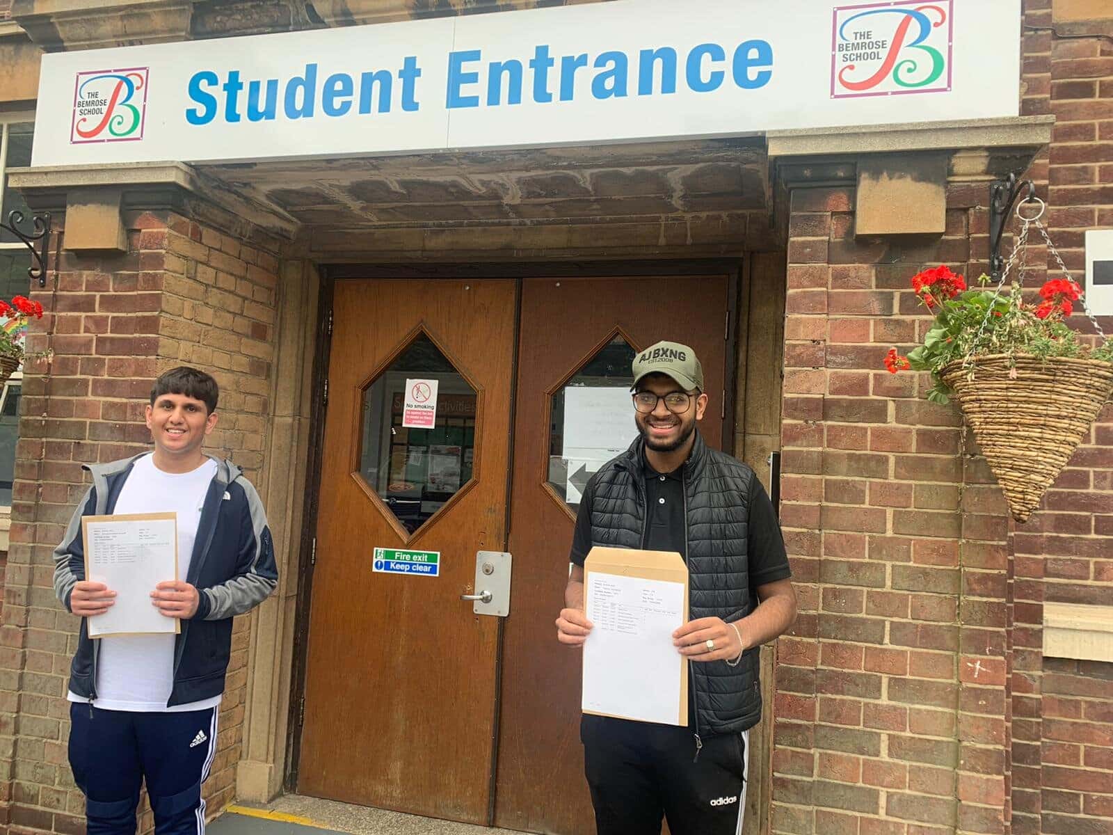 Hamza Hussain (left) and Hasnain Mahmood (both 18) are off to their chosen universities after collecting their results from The Bemrose School