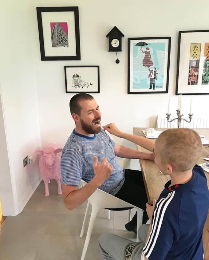Harrison takes a swab from his dad, Steve, and is encouraging more people to join the stem cell register.