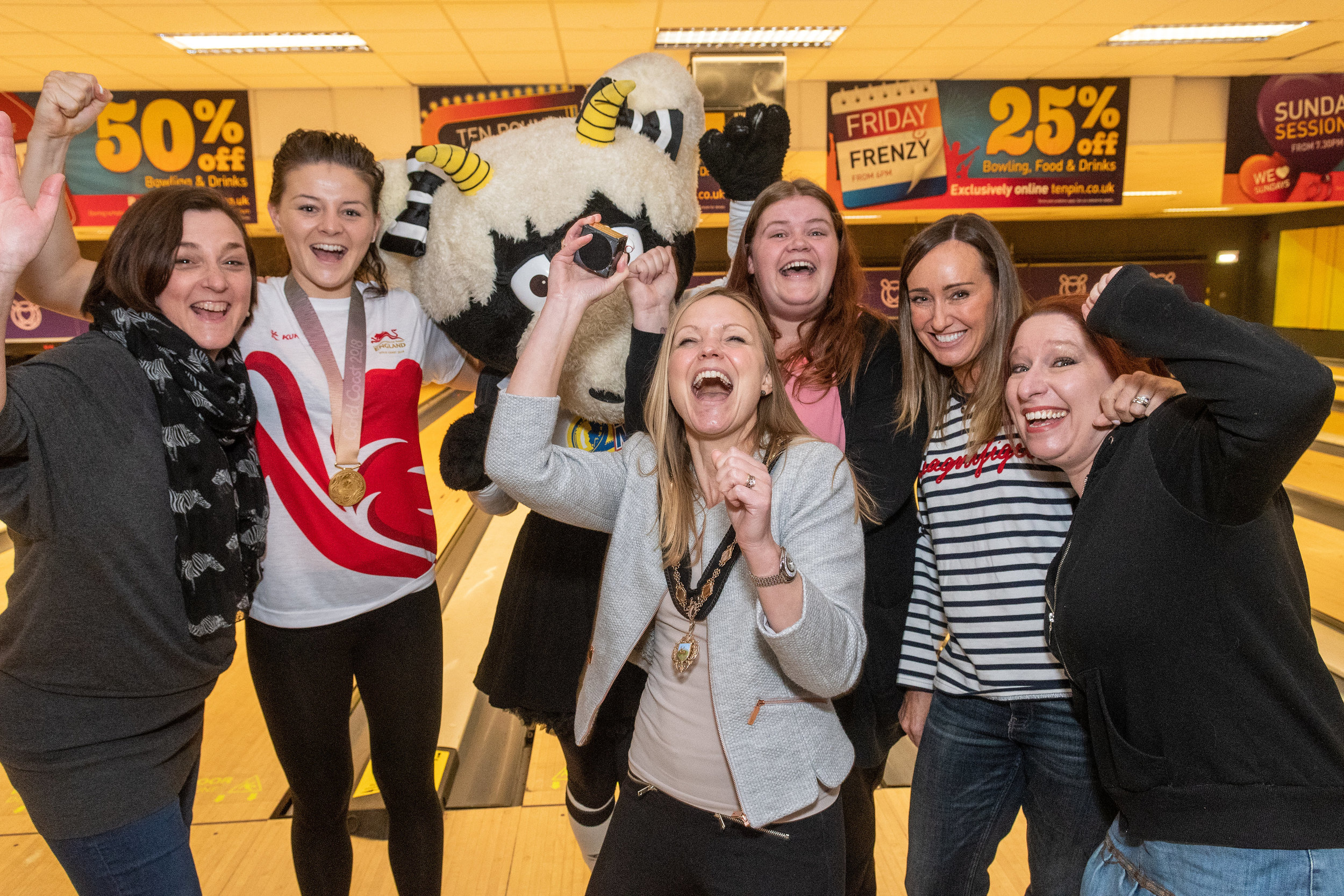 Juliette Whitby, wife of Mayor councillor John Whitby, celebrates her victory following the Mayor v Mayoress charity event at Tenpin Derby with Commonwealth gold medalist Sandy Ryan and Derby County mascot Ewie, plus members from charity Derbyshire …
