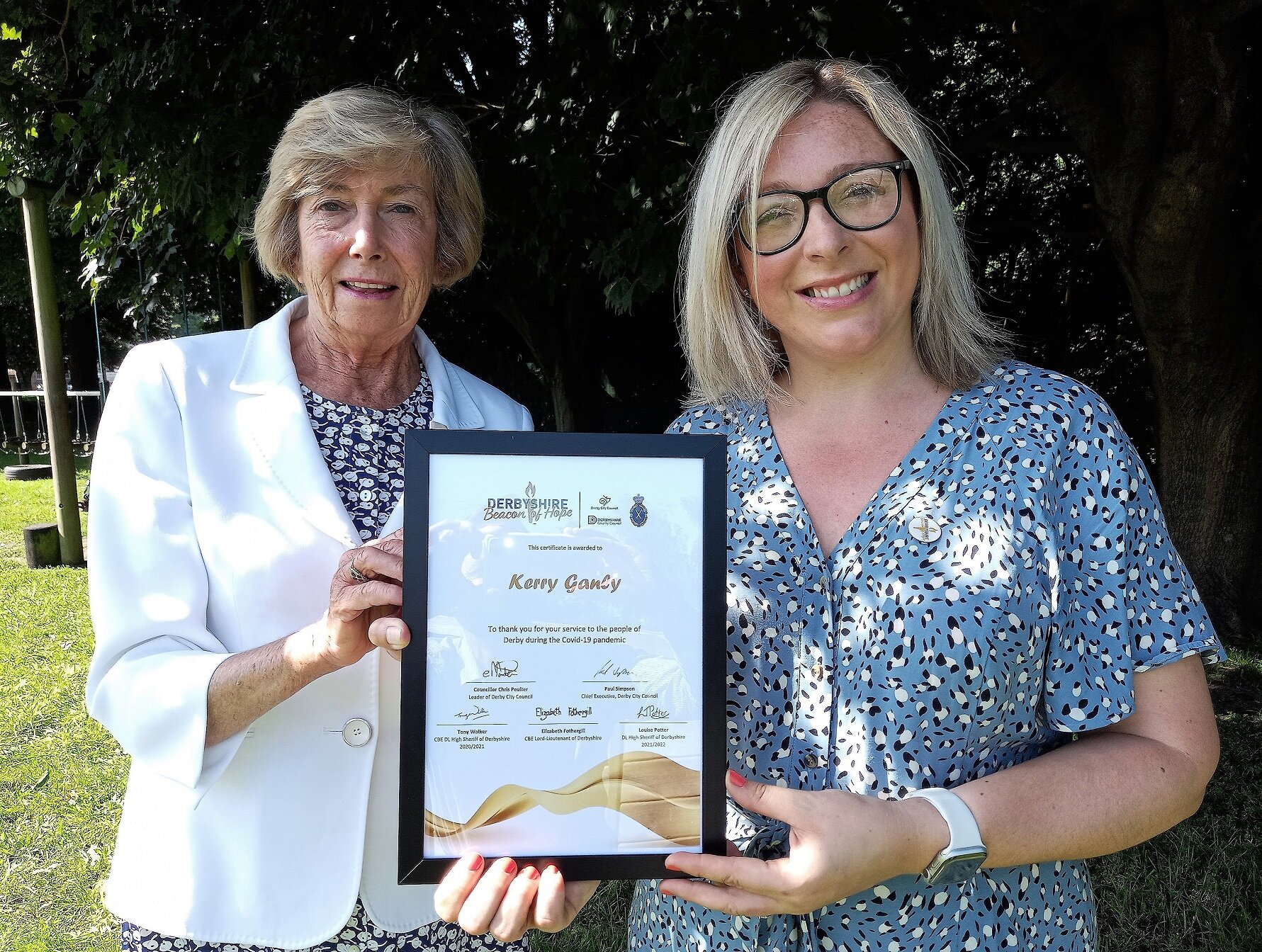 Fiona Cannon, Derbyshire deputy lieutenant, presents a Beacon of Hope Award certificate to Kerry Ganly, PR account and social media manager at Derby-based public relations agency Penguin PR.