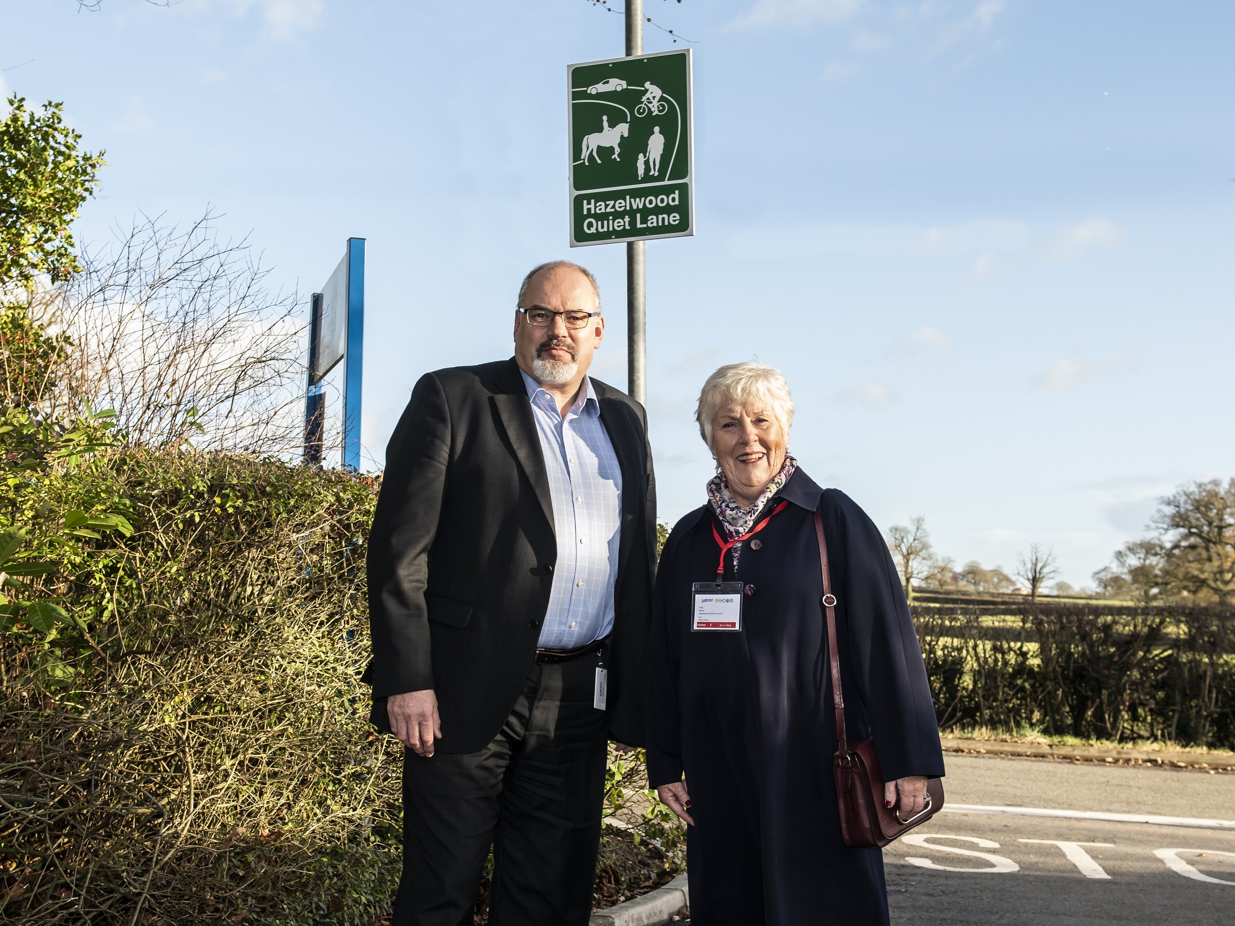 Left, Simon Griffiths, general manager of Lubrizol Hazelwood, and Judy Harris from Hazelwood Parish Council, with the Quiet Lane signs, which have been erected at the entrance to the firm’s site in Nether Lane. Penguin PR: public relations, media an…