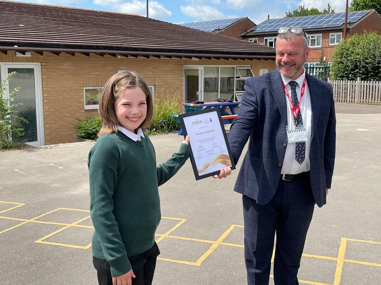 Marnie Wadlow, 9, and Derbyshire’s Deputy Lord Lieutenant Terry McDermott with award.