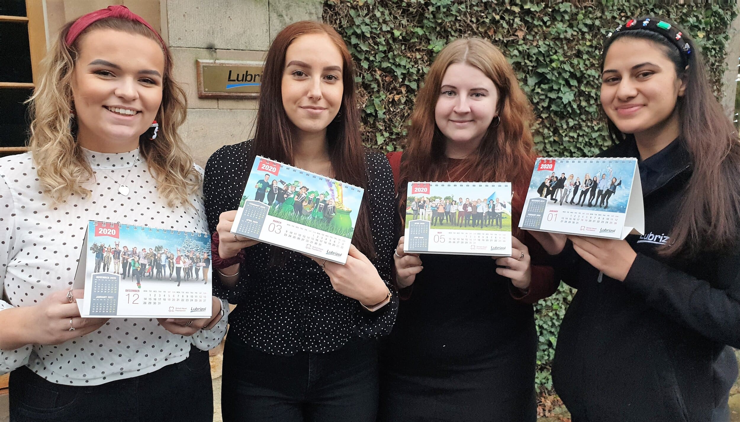 Placement students Amy Turner, Victoria Hurst, Sophie Heritage and Rahmeen Javaid with copies of their 2020 charity calendar, which they have produced in aid of the BHF.jpg