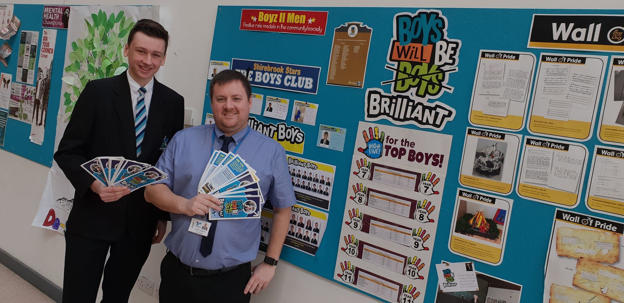 Shirebrook Academy student Ben Clarke and vice principal Andy Gilbert with the school’s boys-only wall of fame, which has been installed to help male students raise their aspirations and see achieving at school as desirable. Penguin PR: Public relat…
