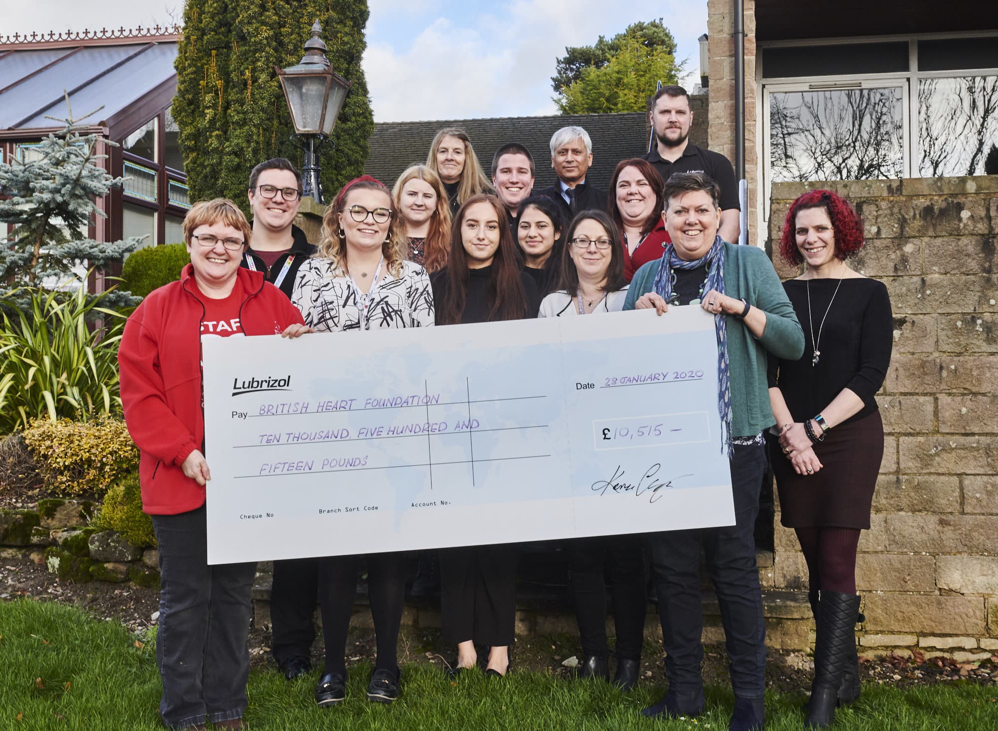 Staff from Lubrizol handing over a cheque Derbyshire’s BHF fundraising manager Paula Scaife and Lubrizol staff during their CPR training