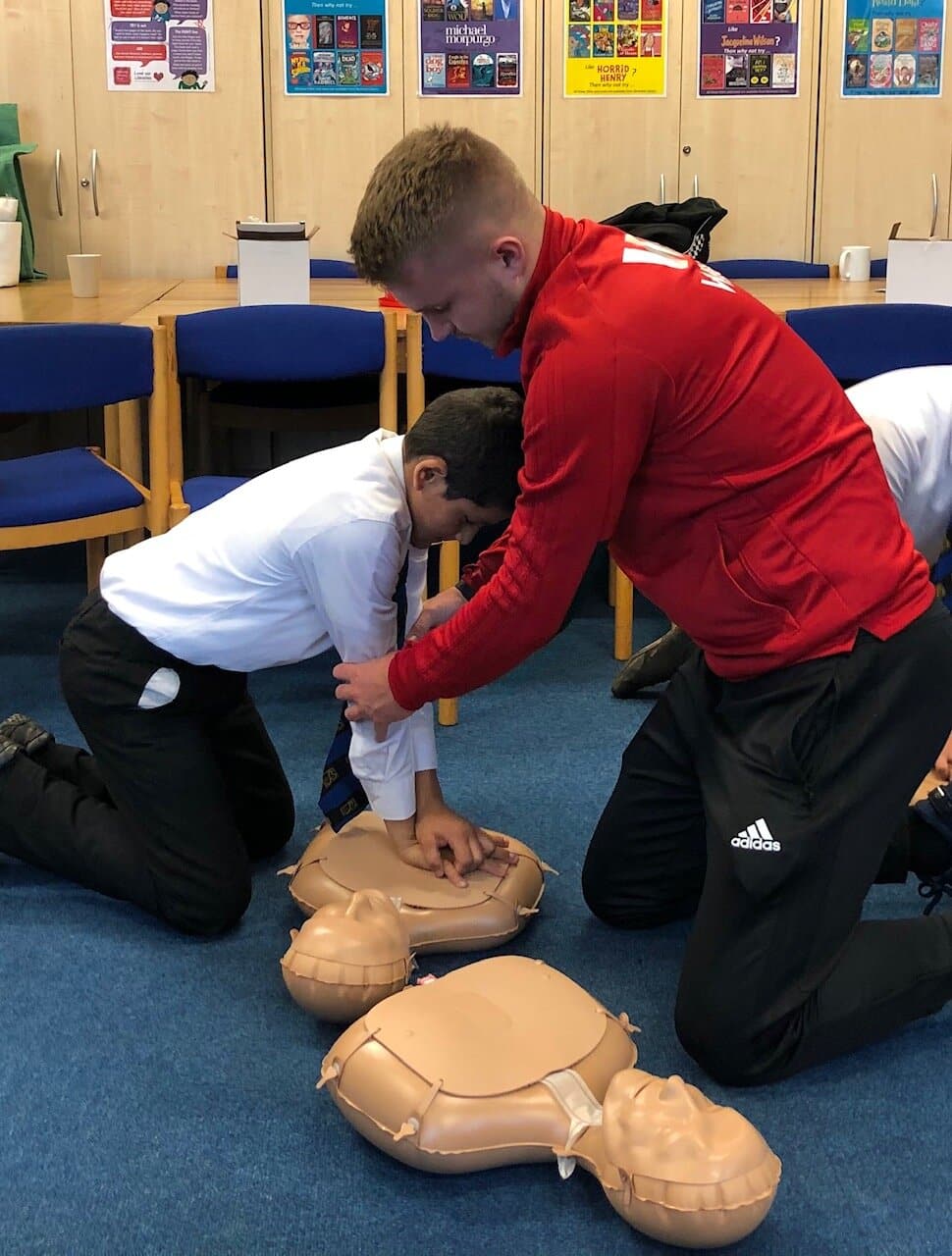 Students from The Bemrose School practice CPR.