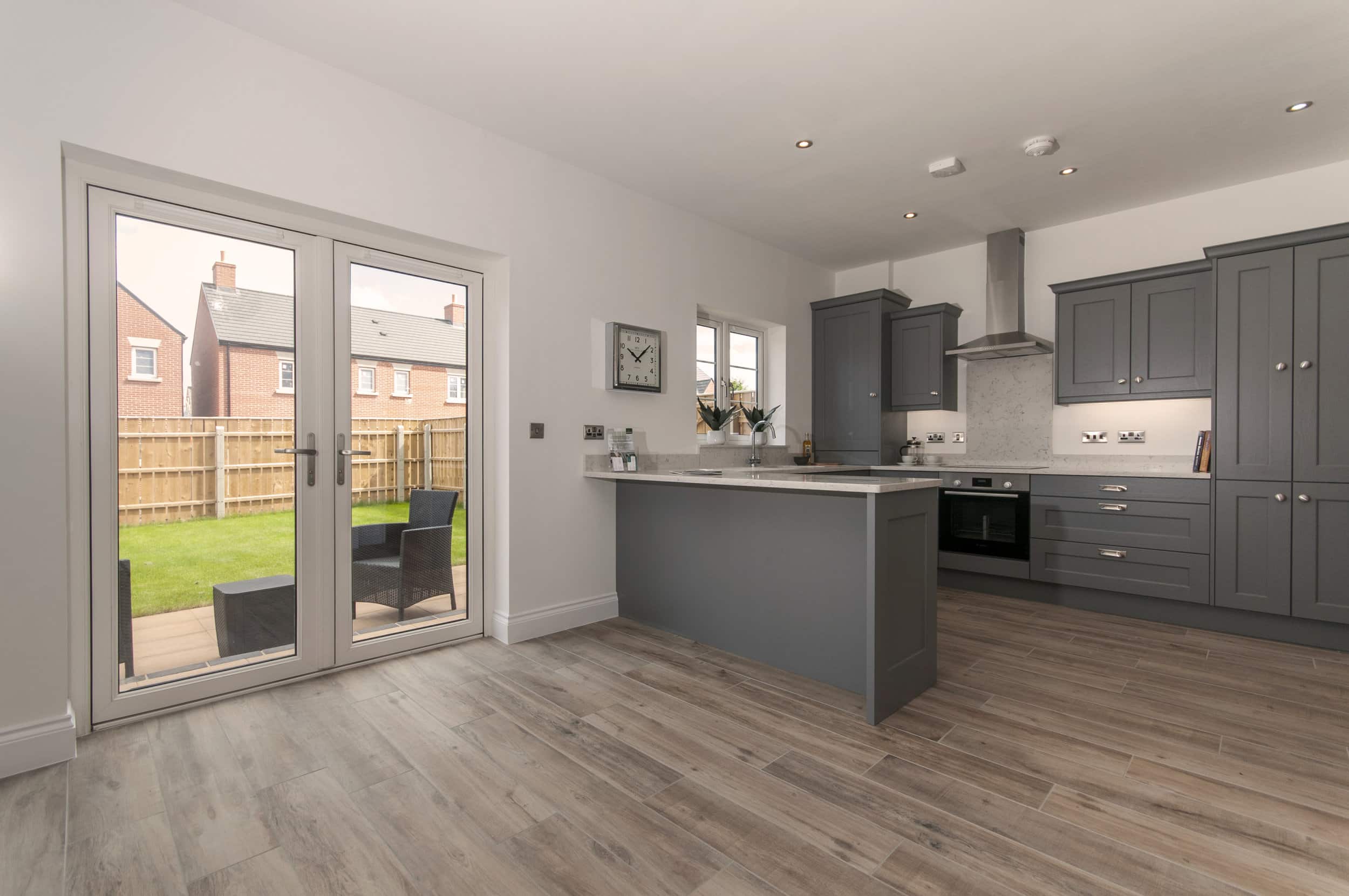 The kitchen in the Deer Park showhome has French doors which lead out to the garden. Each Deer Park home comes with freshly-laid turf as standard. Penguin PR: public relations, media and communications