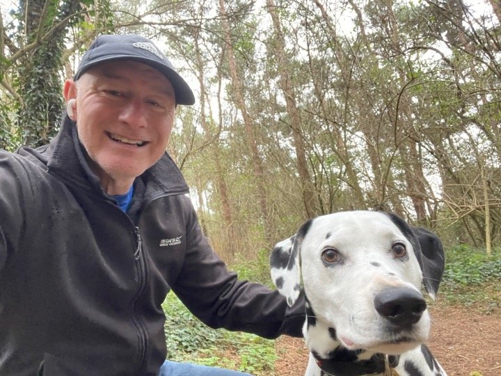 ActionCOACH Derby owner Tony Prueitt with his dog, Buddy