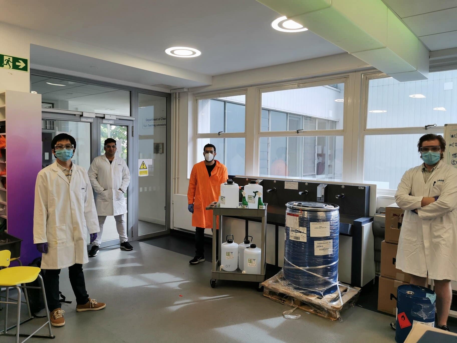 Warwick Uni staff and students with the donated drum of Carbopol.jpg
