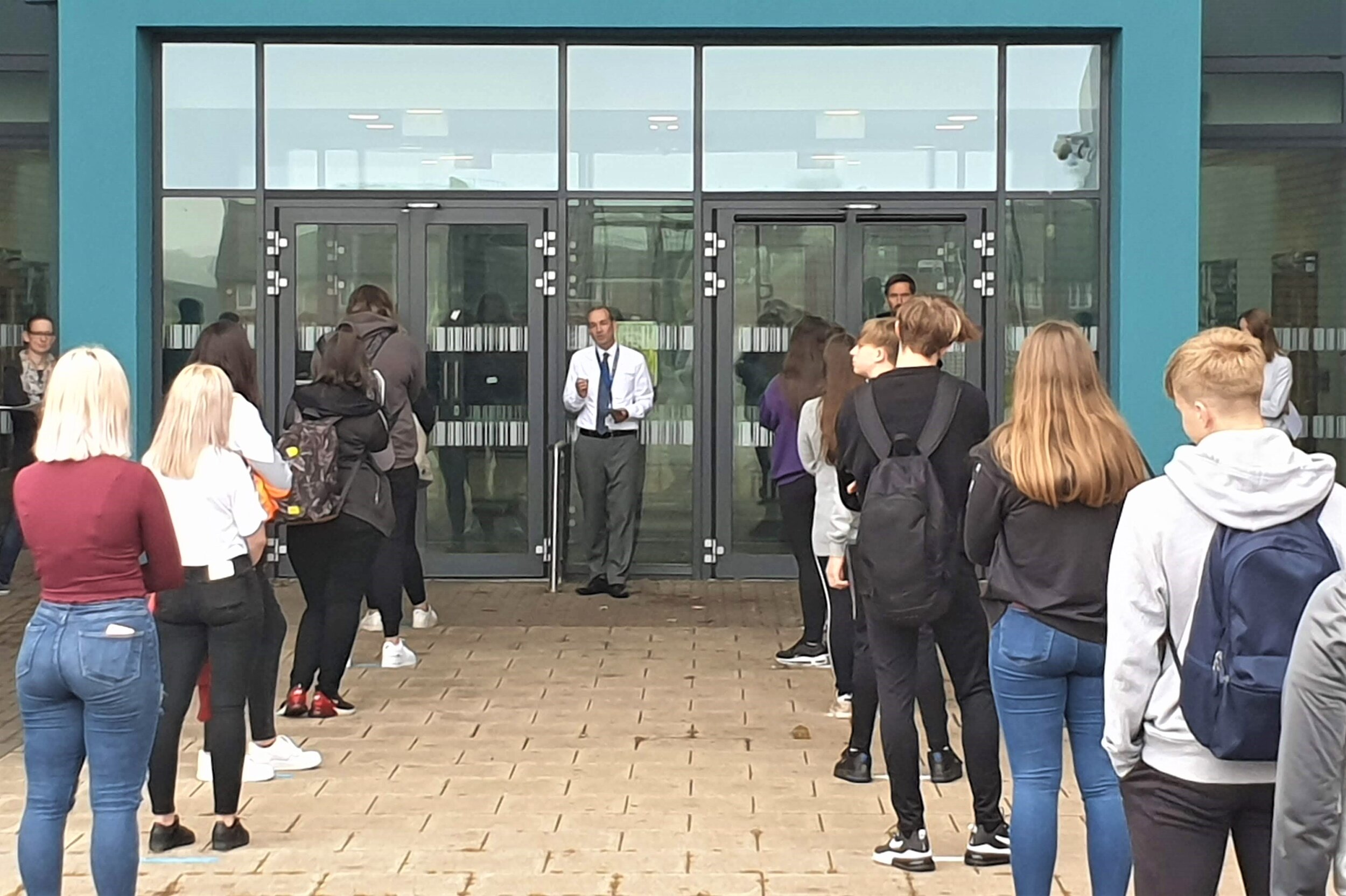 Year 10 students line up outside Shirebrook Academy this morning after the school started to readmit more students following the coronavirus lockdown. They will be taught in reduced numbers with a host of social distancing measures in place.