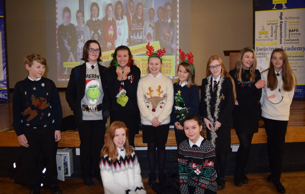 Year 7 pupils from Swinton Academy show off their Christmas jumpers. Max Godber Millie Ramsden Grace Cawkwell Lucy Hurst Latia Redman Y8 Emma Taylor Mia Brown Lilannah Young Front - Kadie Davis, Teegan Latham. Penguin PR: public relations, media and…