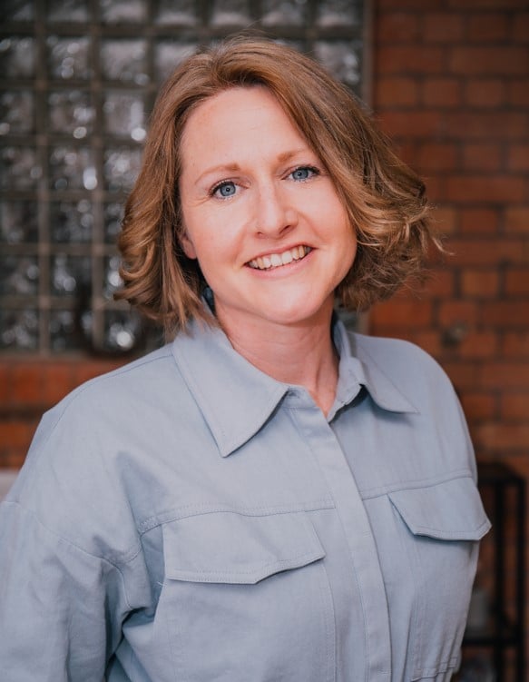 A picture of a woman smiling at a camera