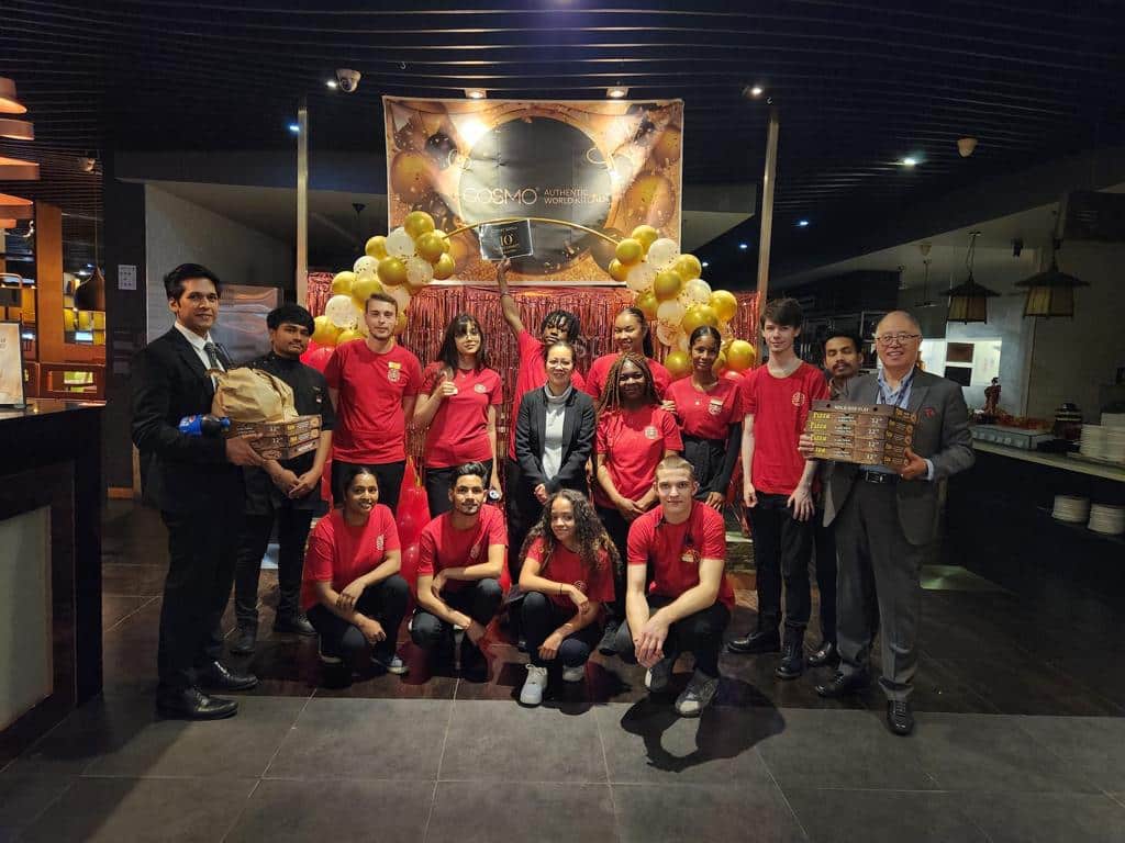 Staff at COSMO Derby celebrating the restaurants 10th year of service 