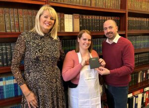 April Allman from Enthusiasm with winning baker Gemma Plummer, from Eddowes Waldron, and Oliver Maxwell president of Derby Law Society.