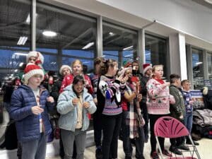 Pupils from Queen's Croft High School and Liberty Jamboree performed as the Sign and Shine choir at Tesco in Lichfield.