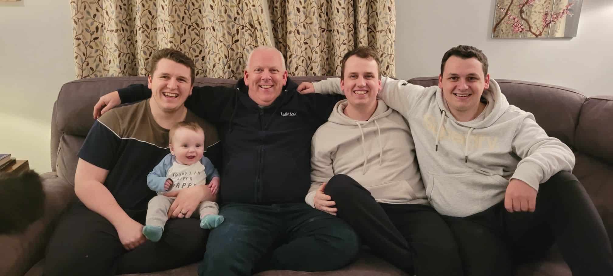 Lubrizol employee Terence Devanney with his three sons and grandson