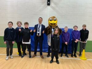 Baggy Bird with co-headteacher Sam Wood and pupils at Queen’s Croft High School