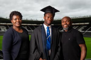 Murray Park student Bolu Shofowoke (centre), with proud parents on the night Dola and Tunde Shofowoke