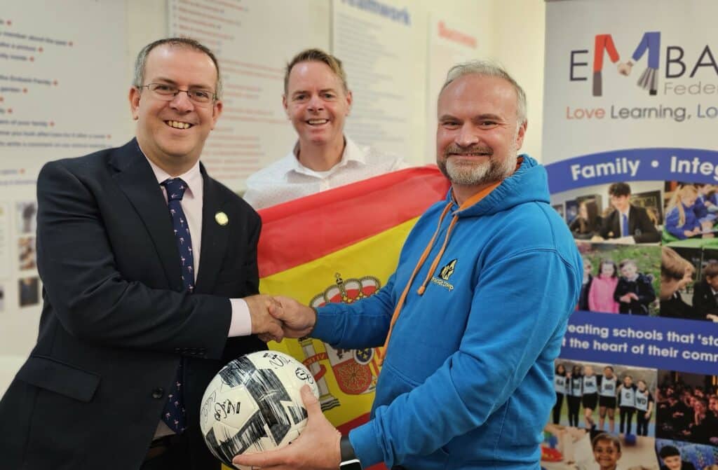 Matt Crawford, leader of Derby sweepstake winners Embark Federation, with Simon Burch, director of Penguin PR, and Chris Edwards, chairman of Derby Kids' Camp.