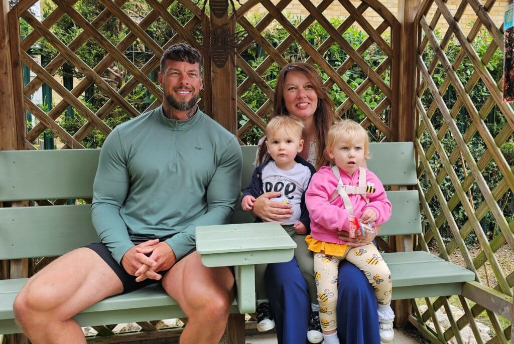 TV Gladiator Giant - real name Jamie Christian-Johal - with Victoria Bull and her grandchildren, Roman and Florence, at the opening of Michael's Garden, a sensory garden at Scargill Church of England Primary School in West Hallam set up in memory of Victoria's son.