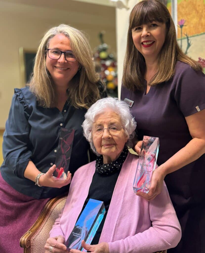 Celeste Turner and Lucille Parsisson of Derby's Brookfields Nursing Home with 95-year-old resident Muriel Davis and three of the award wins