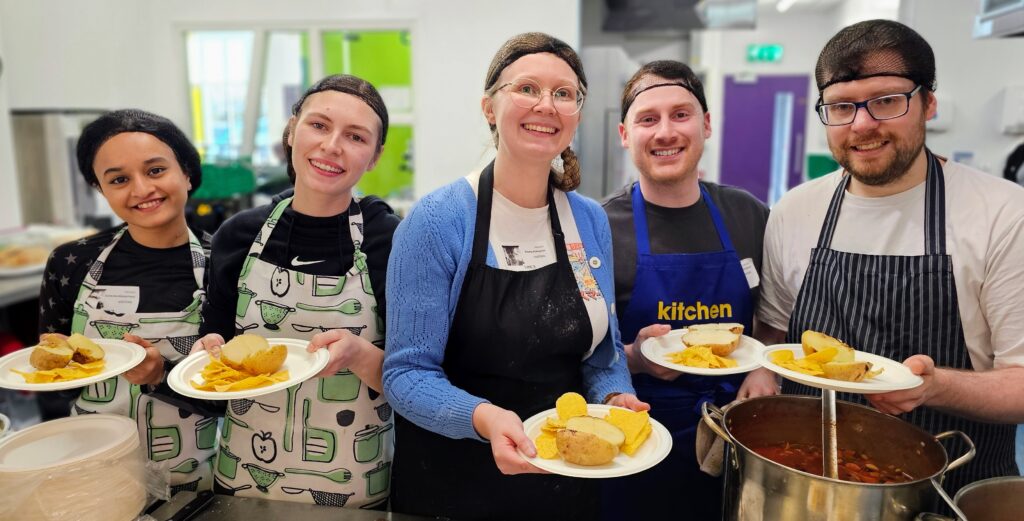 From left, JDR Group staff Ashlesha Wargantiwar, website design and project coordinator, Sophie Teece, digital marketing assistant, Emma Ablewhite and John Skidmore, who are head of client development and content coordinator Rhys Laven serve up lunch at the YMCA Derbyshire.
