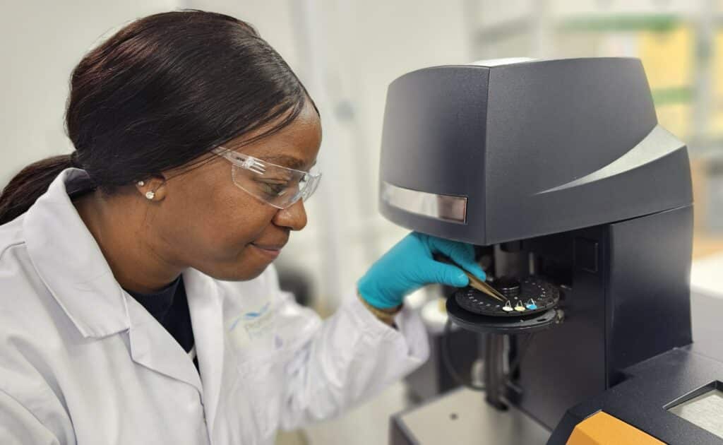 Leah Matsinha, materials development manager at Promethean Particles, uses a thermal gravimetric analyser (TGA), which is part of a £110,000 investment in new equipment.