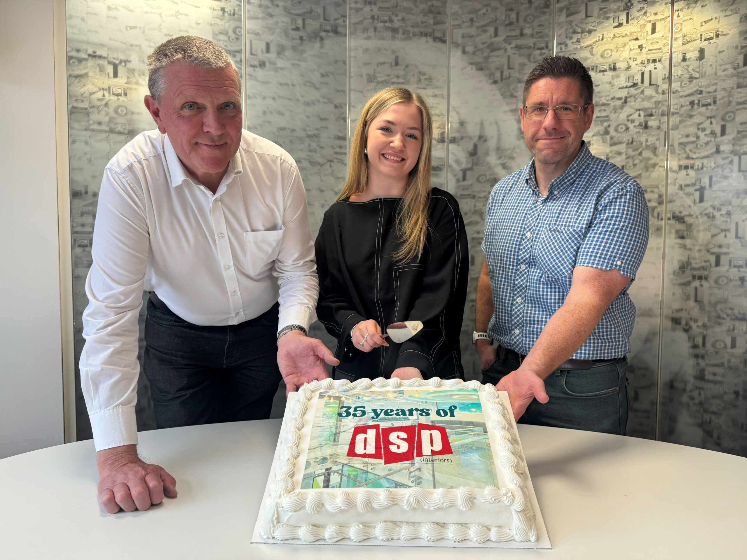 Employees at DSP interiors celebrating 35 years of excellence