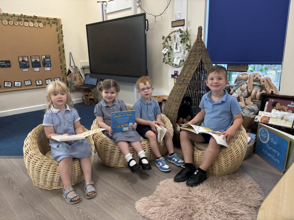 Children reading at The Nest