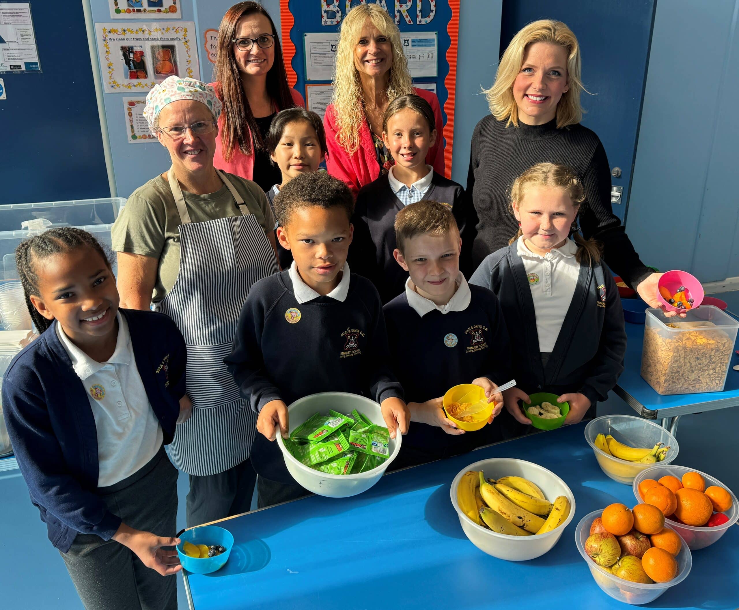 Pupils at the school pick out their favourite breakfasts with, pictured at the back (l to r) teaching assistant Mandy Dudden, school business manager Victoria Lindsay, head teacher Sarah Briggs and South Derbyshire MP Samantha Niblett