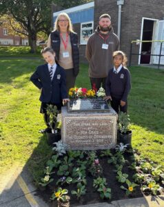 Helen Wathall and Reece Marsh from Art Stone Memorial with pupils from Royal School for the Deaf