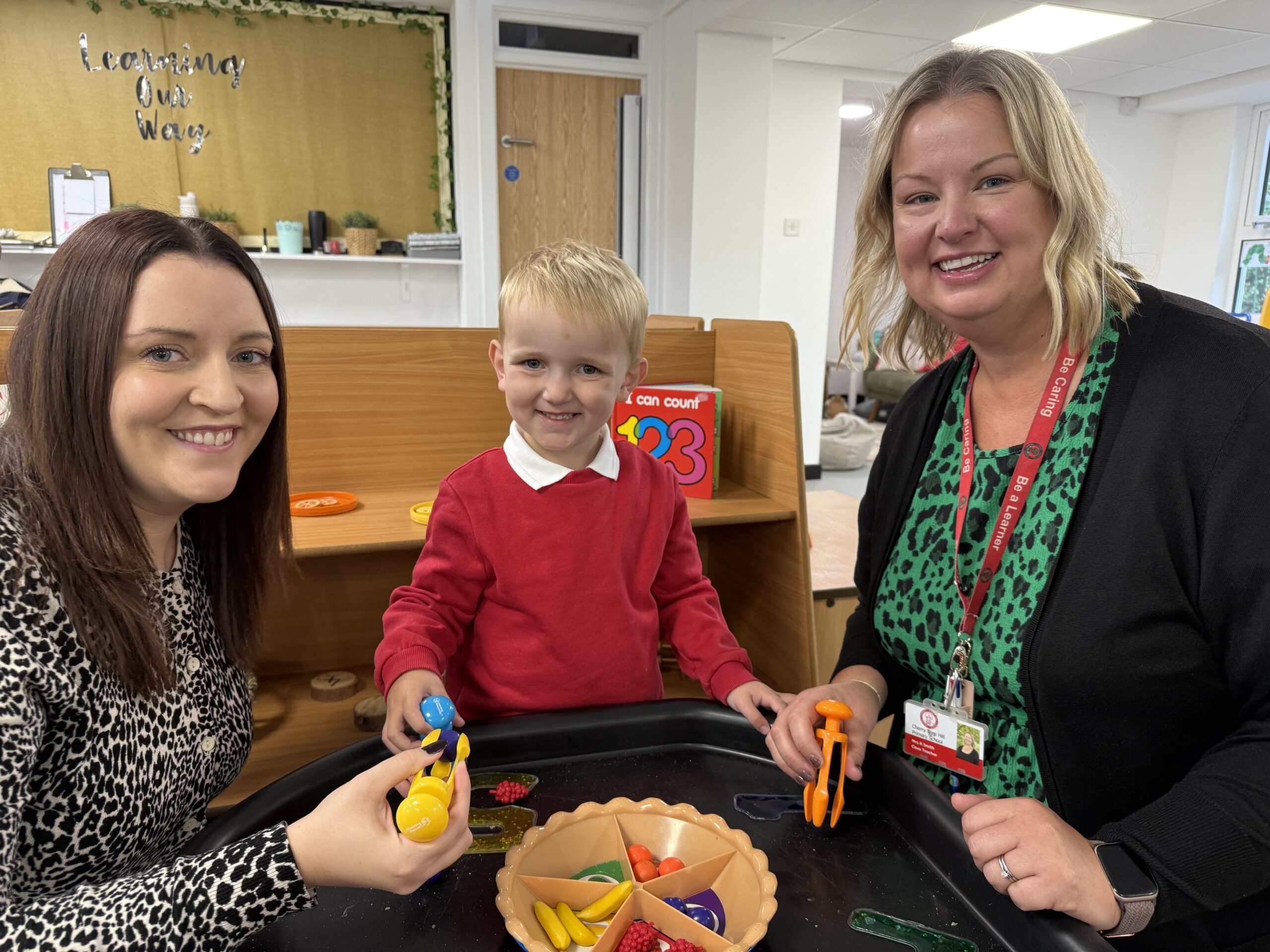 Beth Wood (left) and Emily Maskell (r) with Arthur who attends the nursery.
