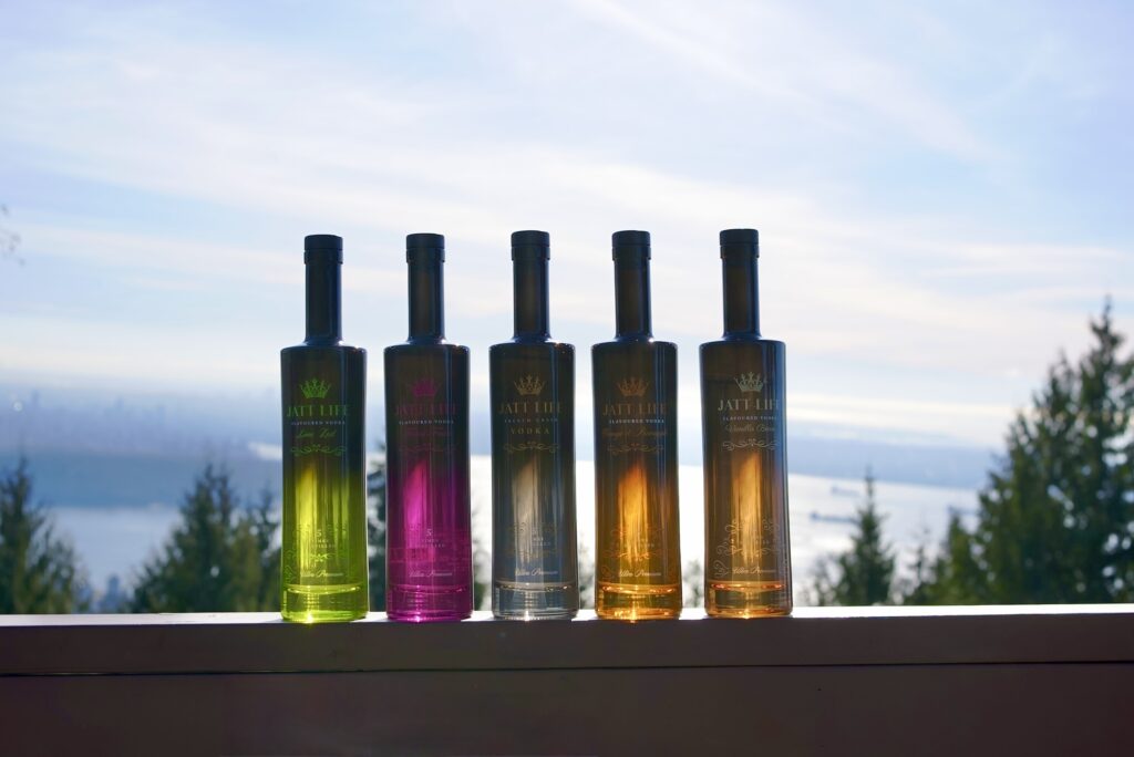 Jatt Life vodka bottles showing the full range of five flavours including original, forest fruits, lime zest, orange and pineapple, and vanilla bean