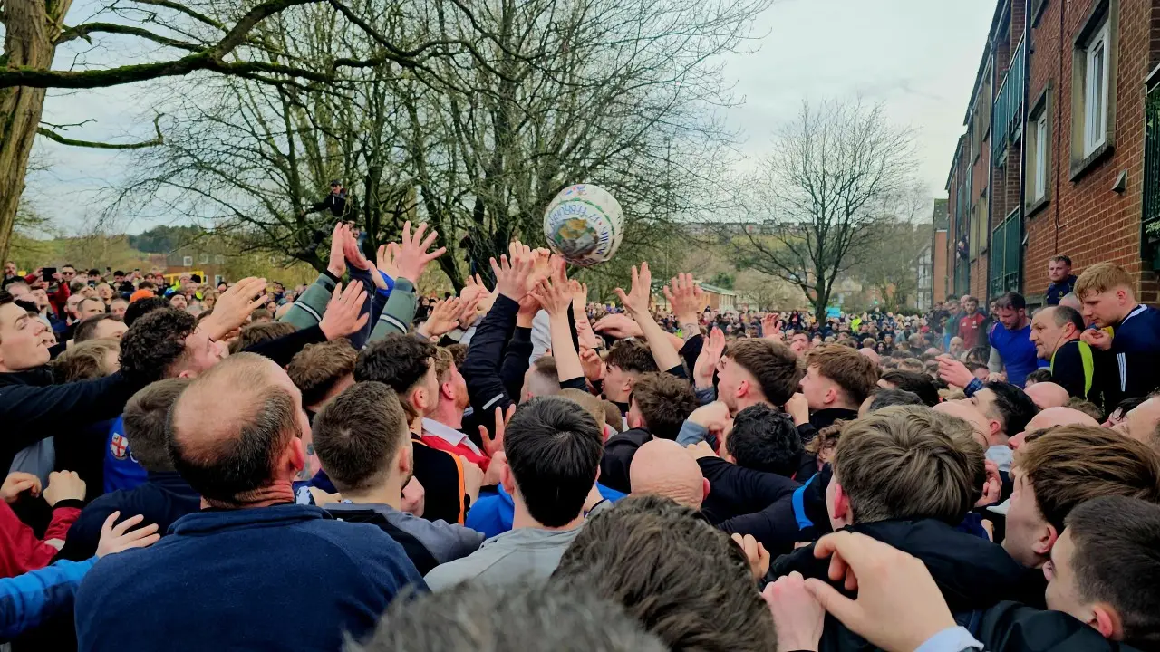 Crowd gathering during Ashbourne Royal Shrovetide Football in Derbyshire.