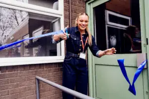 Jodie Ounsley, also known as Fury from TV series Gladiators cuts the ribbon to open the schools new residential block