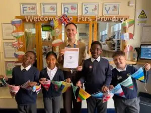 Teacher Thomas Silkstone with pupils from Firs Primary School in Derby