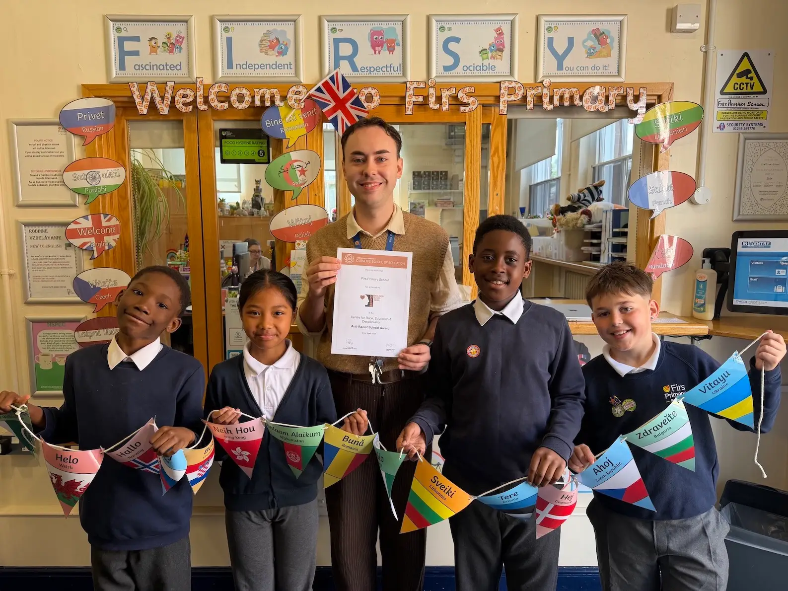 Teacher Thomas Silkstone with pupils from Firs Primary School in Derby