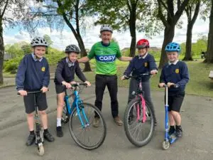 Rob Hull, head teacher at Kilburn Junior School, and pupils.