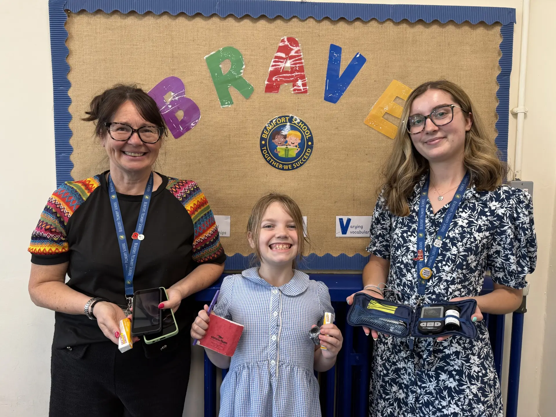 Beaufort Primary School pupil Gracie Clarence with teaching assistant Paula Gregory and diabetes play specialist Hayley Wright, holding the equipment used to help manage Type 1 diabetes.