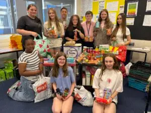 Murray Park School students with careers leads, Tim Taylor an Jan Woolley spent the day packing food hampers for families in need across the school community
