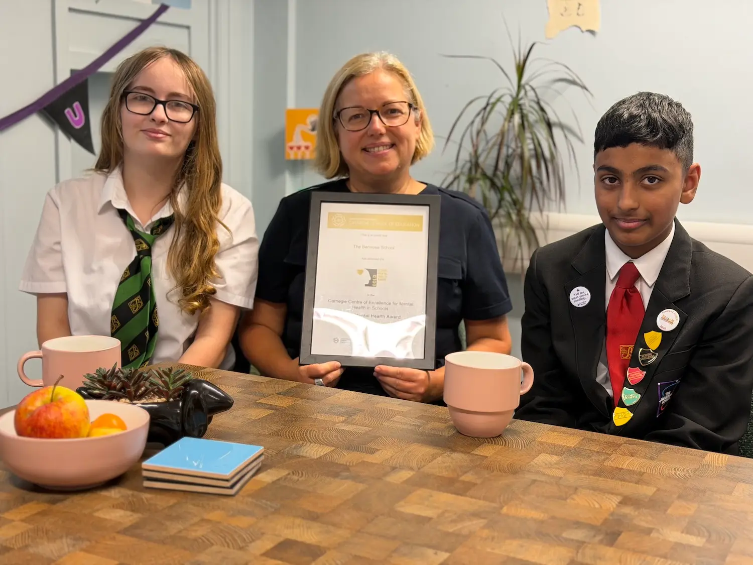 Mental health and wellbeing lead, Karen Lamb with the chair mental health ambassadors, Leah and Taha