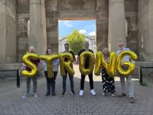 A team from Nine Dots Development celebrating their ‘Strong in all areas’ judgement from Ofsted, pictured outside their Derby offices on Vernongate: Rob Nuttall, Information and Guidance Officer; Jess Walsh, Training Co-ordinator; James Davison, Co-founder and Director; Jordan Burke, Co-founder and Director; Angela Mapp, Quality and Curriculum Manager; Andy Hallam, Apprenticeship Manager